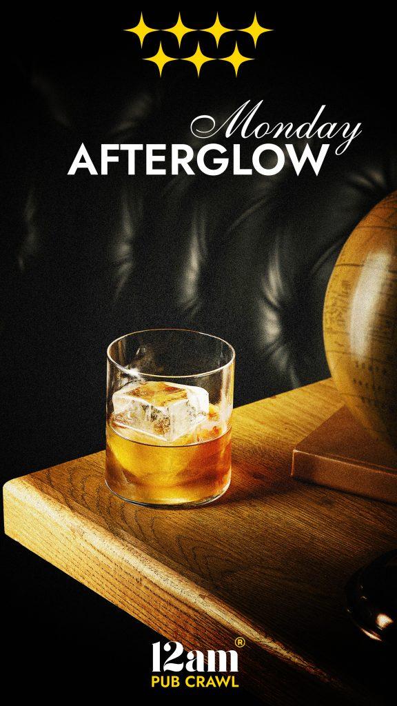 Monday Afterglow Madrid Pub Crawl flyer featuring a glass of whisky on a wooden table, with four gold stars and '12am Pub Crawl' logo. Perfect for experiencing Madrid's nightlife even on a Monday.