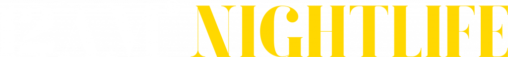 12AM NIGHTLIFE main footer logo in white and yellow text, representing Europe's biggest and #1 social Pub Crawl, specializing in unforgettable nightlife experiences in Madrid.